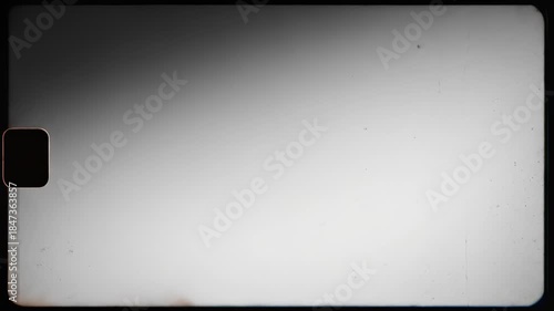 Grayscale atmospheric gradient featuring subtle film grain texture slowly shifting from dark to bright tones providing a tactile vintage abstract backdrop transition, monochrome, shadow