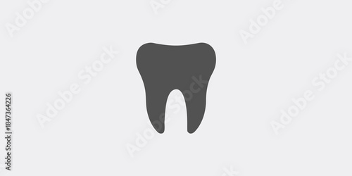 Simple illustration of a single dark gray tooth on a light background