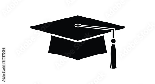 A striking black graduation cap is prominently displayed creating a bold academic silhouette