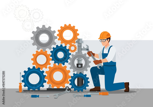 Mechanic assembling gears with a wrench, wearing safety gear.