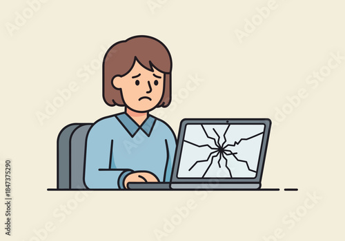 Person looks sadly at a laptop with a cracked screen.