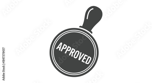 A black and white circular stamp displaying the word approved presented as a striking silhouette