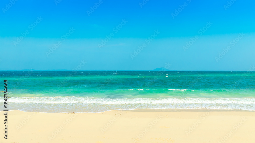 Fototapeta premium Beach sand background for summer vacation concept. Beach nature and summer seawater with sunlight light sandy beach Sparkling sea water 