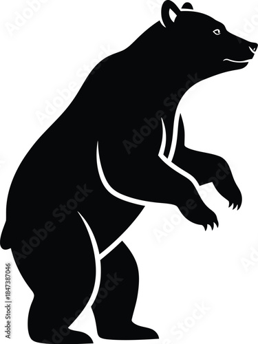 Silhouette of a standing bear rearing up on its hind legs