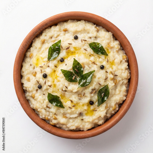 traditional ven pongal served in an earthen clay bowl photographed from top view isolated on white background premium south indian food stock image