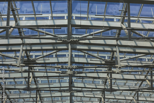 Metal construction of window frames of glass ceiling of modern architecture.