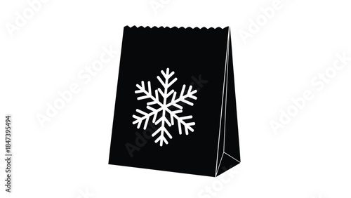A black gift bag adorned with a striking white snowflake design