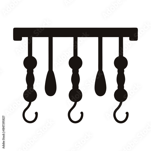 Silhouette image of a rack with hooks and teardropshaped hangings, decorative