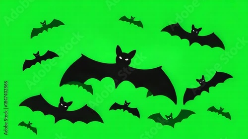 Flock of Black Bats Flying Across a Green Screen