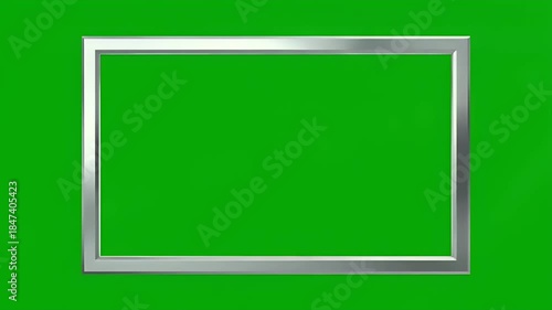 Modern silver display frame over a vivid chroma key green backdrop, ideal for creative digital content, motion graphics, virtual set integration, and sleek media presentations