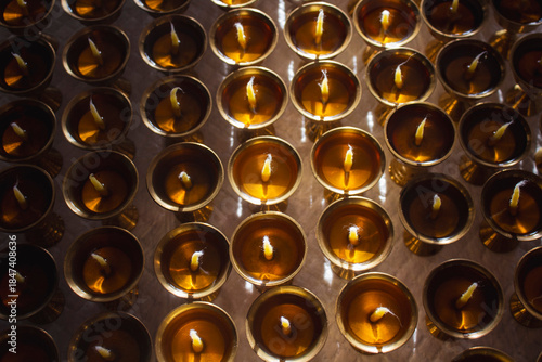 Buddhist Altar Candles at Religious 108 Butter Lamp Festival in Temple Monastery. Pouring Melted Butter Oil. Preparation process