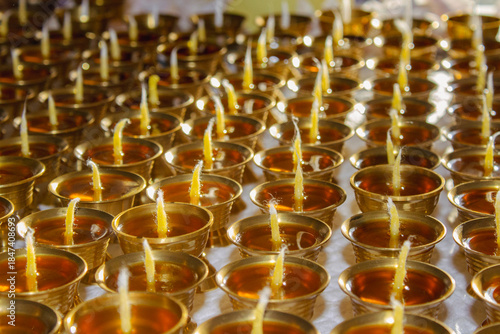 Buddhist Altar Candles at Religious 108 Butter Lamp Festival in Temple Monastery. Pouring Melted Butter Oil. Preparation process