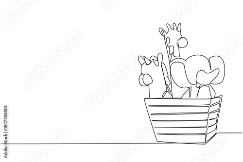 One line drawing of dolls placed inside a basket, featuring giraffe, elephant, and unicorn toys, created in a childhood concept to celebrate World Doll Day as an international event.