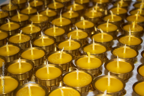 Buddhist Altar Candles at Religious 108 Butter Lamp Festival in Temple Monastery. Pouring Melted Butter Oil. Preparation process