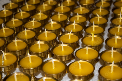 Buddhist Altar Candles at Religious 108 Butter Lamp Festival in Temple Monastery. Pouring Melted Butter Oil. Preparation process