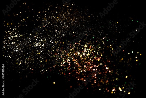 Soft scattered gold and copper glitter on black night background, dreamy sparkling dust texture perfect for holiday celebrations, party overlays, invitations, posters and digital artwork

