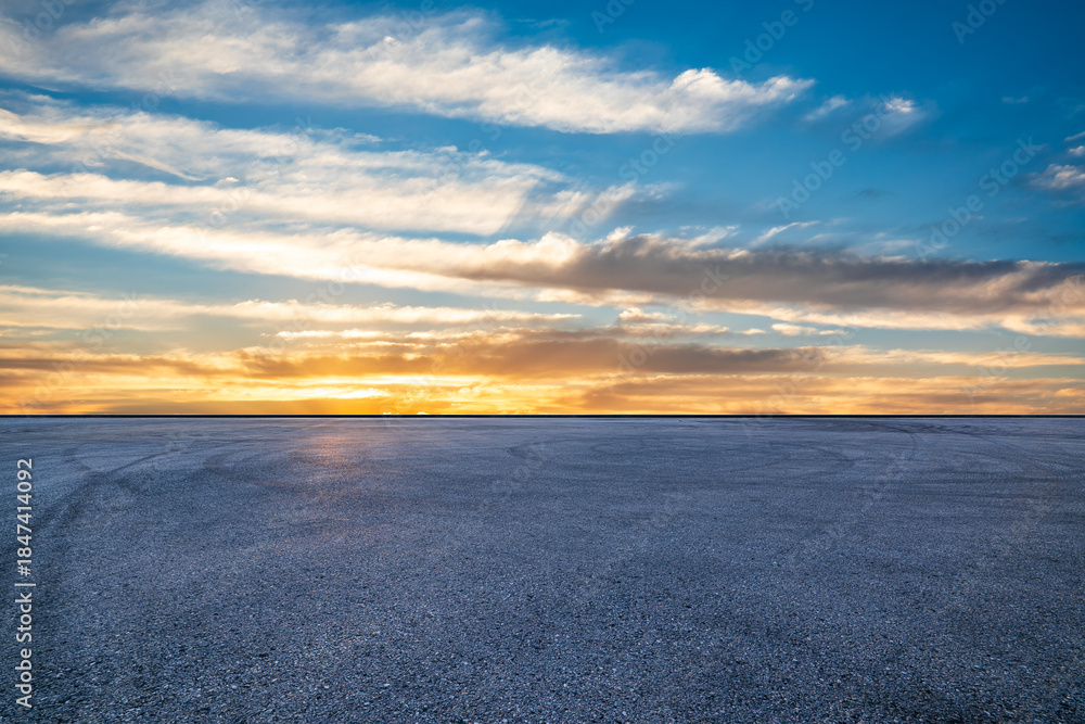Fototapeta premium Empty asphalt road and beautiful sky clouds landscape at sunset