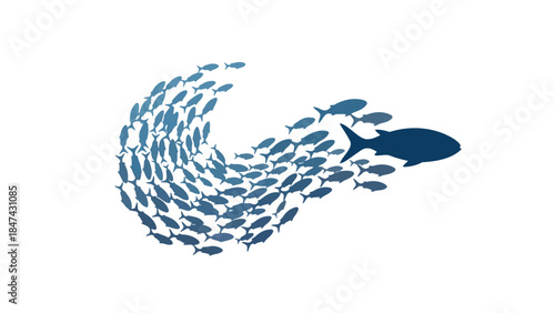 A large school of blue fish moving in unison with a larger predator fish in pursuit creating a dynamic swirling motion
