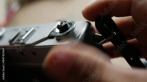Photographer Hand Pressing Shutter Button on Vintage Film Camera Taking Picture Action Shot