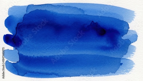 Abstract blue watercolor background with varying shades and textures on white paper, perfect for creative designs and artistic projects.