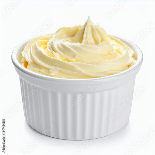 Delicate creamy swirl in a ramekin with a clean white background, emphasizing smoothness