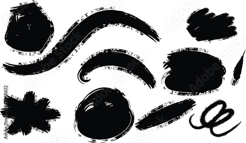 A collection of various black ink brush strokes and shapes on a white background