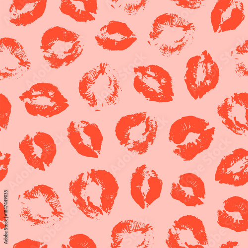 Seamless pattern with red lipstick prints on a pink background. Vector Valentine's day pattern
