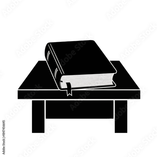 Book on table silhouette icon. Black and white vector illustration of a bible or textbook. Education and reading symbol isolated