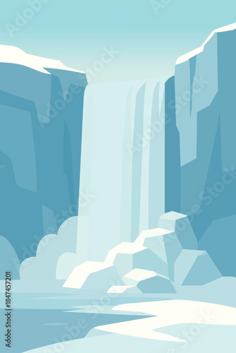 Stunning icy waterfall cascading between snow covered cliffs