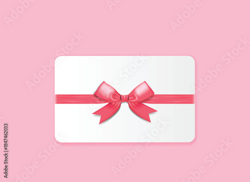 White Gift Card with Pink Ribbon and Bow on Pink Background