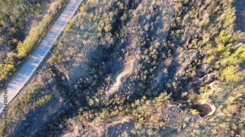 flying a drone over a gorge in the forest
