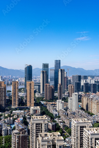 Urban Skyline with Modern Skyscrapers and Mountains
