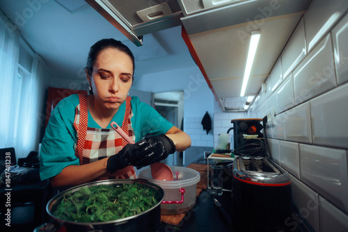 Konstfotografi Housewife Prepares Nettles by Scalding them in a Pot