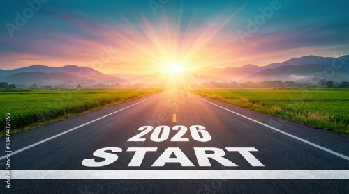 Happy New Year 2026 a scenic road leading towards a bright sunrise with the words 2026 start prominently displayed on the pavement for happy new year 2026
