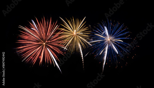 Festive colorful fireworks display isolated on black background for celebration and anniversary