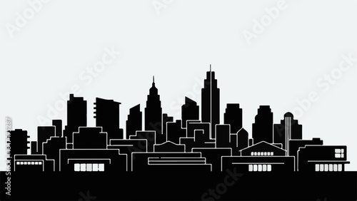 Sleek modern city skyline silhouette against a bright, clear sky.