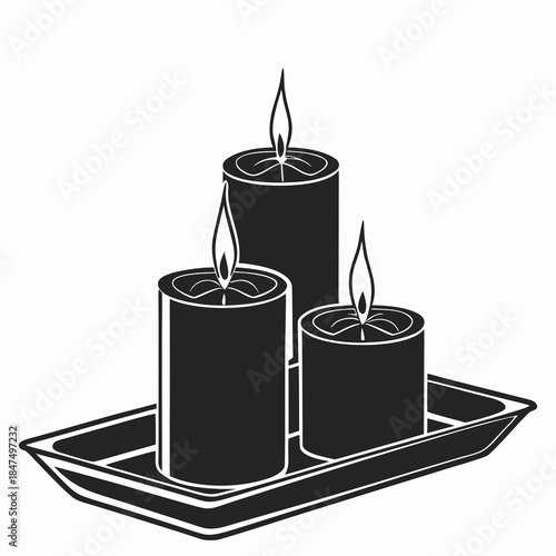 Black silhouette of three candles on tray with flames