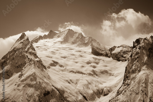 Glacier in winter mountains.