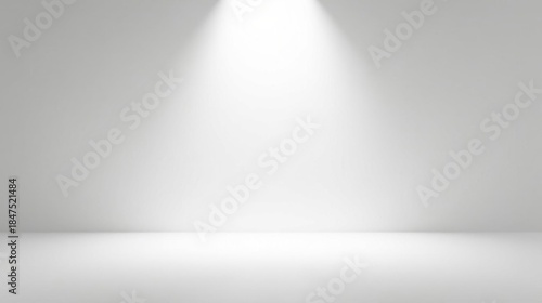 Clean, bright, empty studio space with a single spotlight illuminating a neutral backdrop, perfect for product photography or graphic design projects.