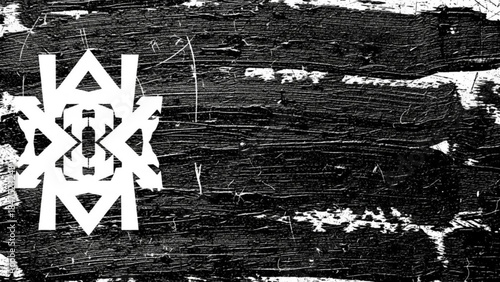 A white geometric symbol on a black and white abstract background with scratches and marks