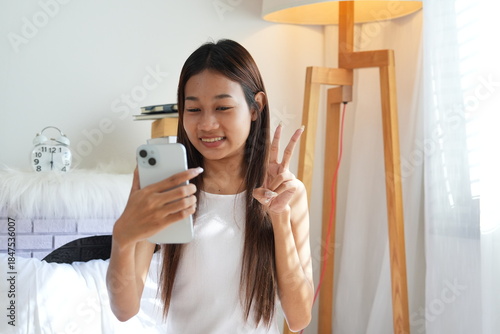 A teenage girl wakes up in the morning and does activities before taking a shower