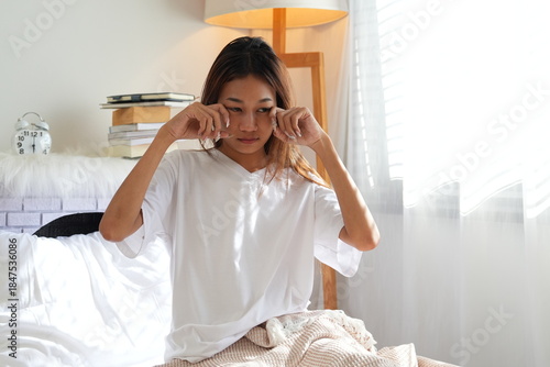 A teenage girl wakes up in the morning and does activities before taking a shower