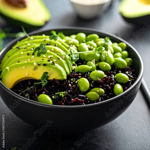 Nutritious Black Rice Bowl Topped with Sliced Avocado and Edamame Beans