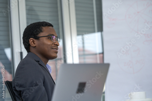 The businessman and computer.  Black businessman