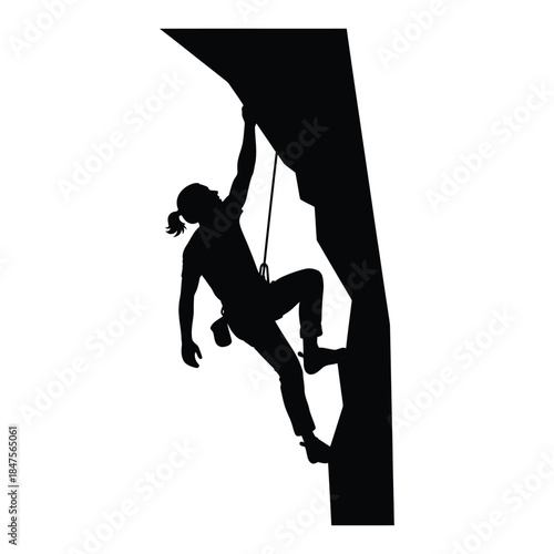 Climber scaling steep rock face silhouette