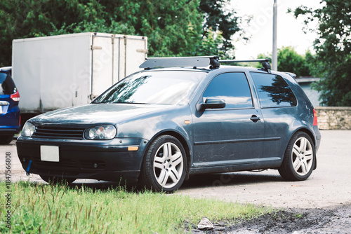 Fototapeta Naklejka Na Ścianę i Meble -  Comfortable small sports car. A stylish retro feel and a strong emphasis on the car's design. Car racing, street racing.