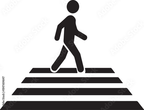 Black silhouette of a person walking on a crosswalk