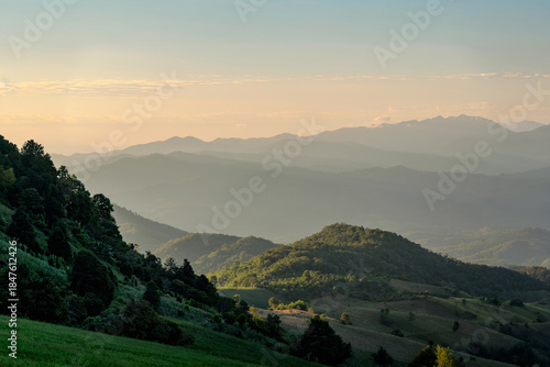 Fototapeta Naklejka Na Ścianę i Meble -  landscape view of sunset over mountain valley