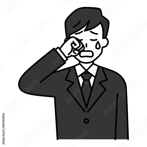 泣く喪服の男性