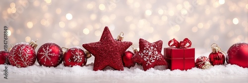 Festive Red Ornaments on Snow with Sparkling Bokeh Background